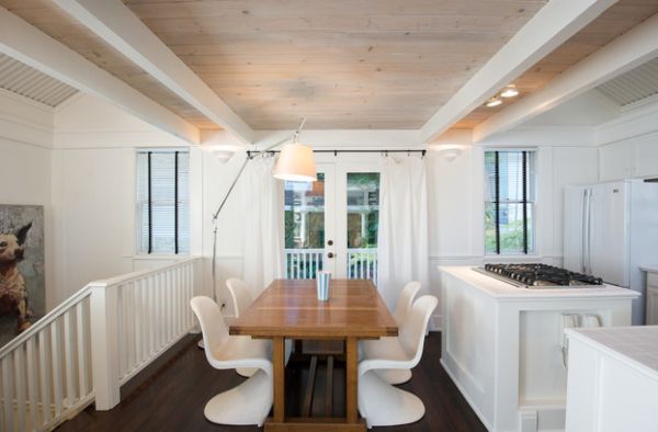 Scandinavian styled dining area with floor lamp that fit in with the elegant appeal