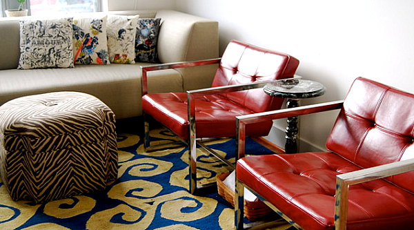 Shiny red chairs in a modern eclectic living room