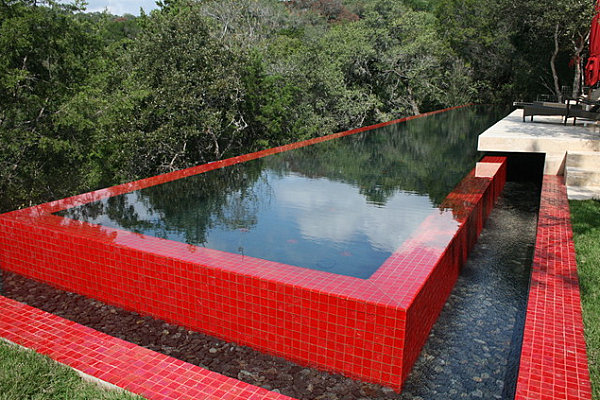 Shiny red tile around a modern outdoor pool