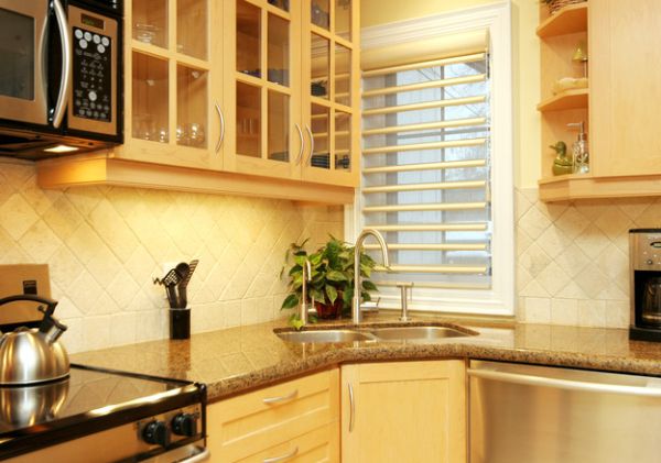 Stylish way to incorporate corner sink in a small kitchen area