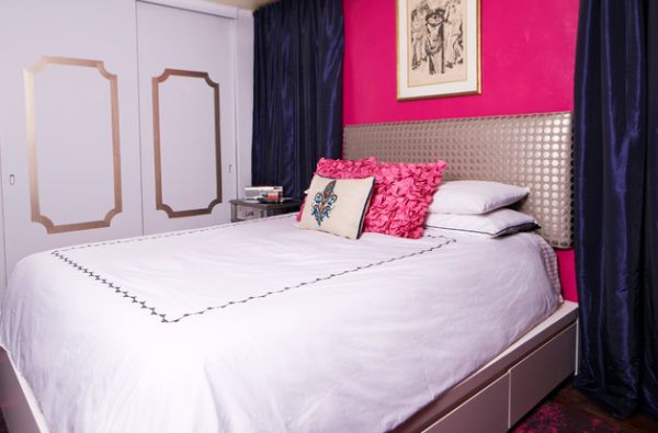 Tufted headboard and trundle bed style up this contemporary bedroom in white and pink