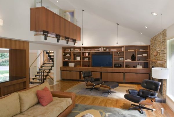 Two black Eames Loungers used elegantly in a contemporary setting