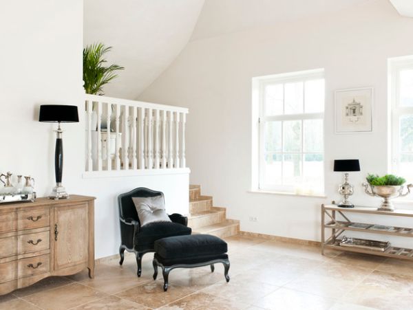 Well placed black lampshades offer necessary contrast in this light and airy room