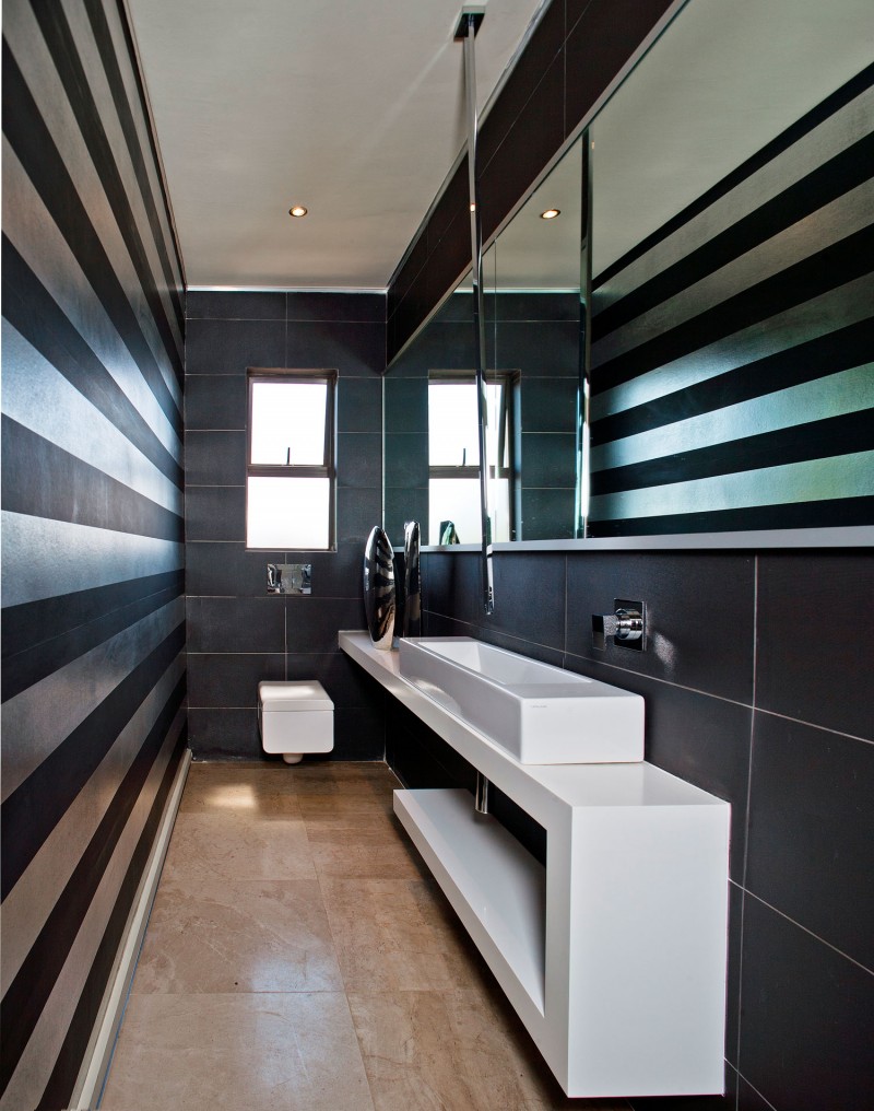 small bathroom with stripes on walls