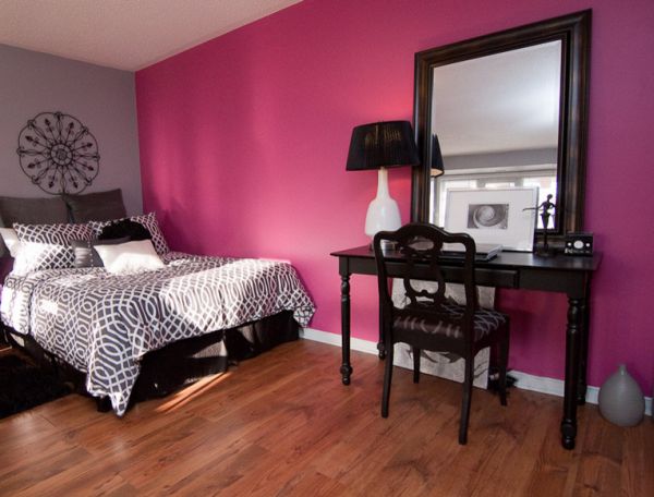 Accent wall in violet fuchsia brings a sense of luxury to the bedroom