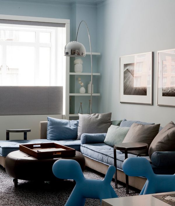 Family room in light blue with Arco floor lamp set in a corner