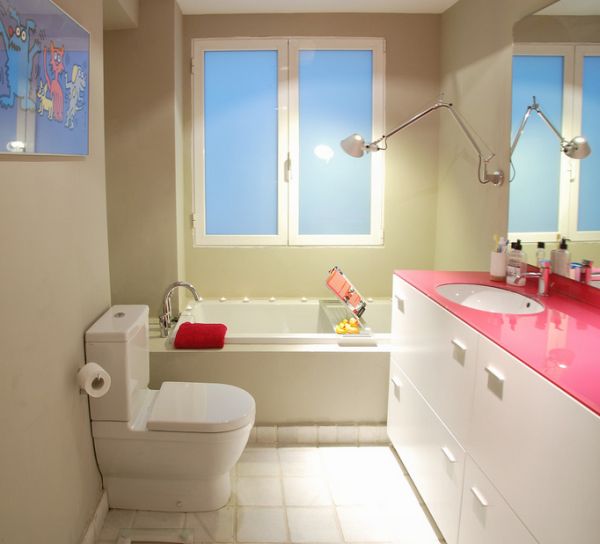 Girls' bathroom with countertop made of gorgeous fuchsia glass