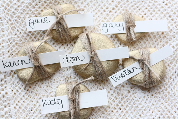 Golden rock place card wrapped with twine