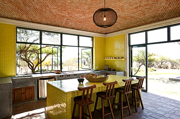 Kitchen with yellow tile accents