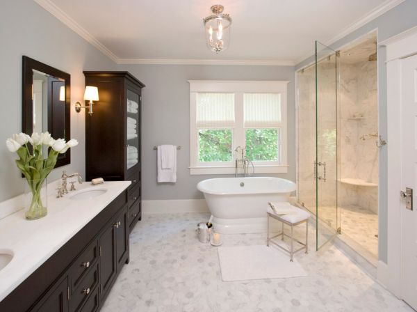 Master bathroom sports a relaxed atmosphere thanks to the midtone gray on the walls