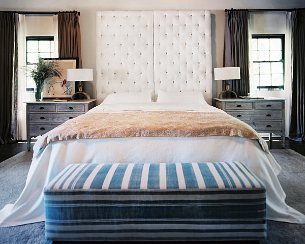 Master bedroom with a tufted headboard