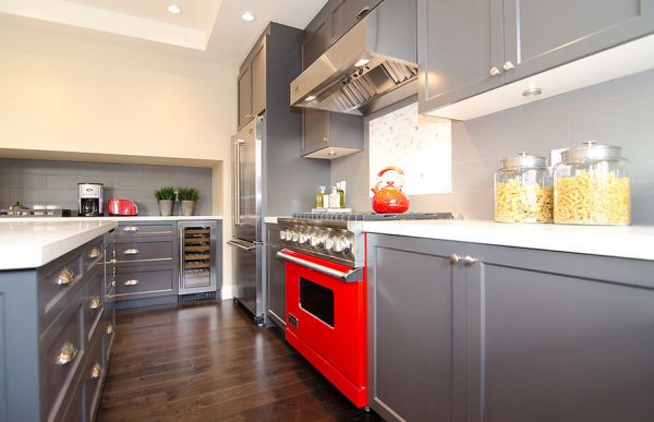 Modern kitchen with gray cabinets and a dash of red