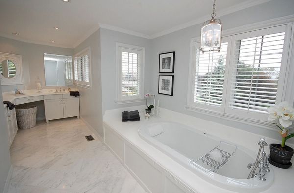 Spacious bathroom in gray and white promises opulence