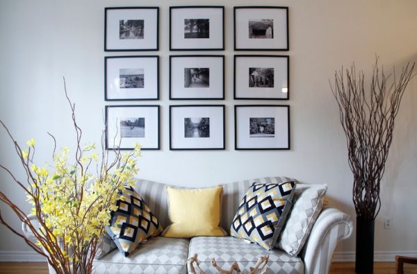 Splashes of yellow accents surround photo arrangement in black and white