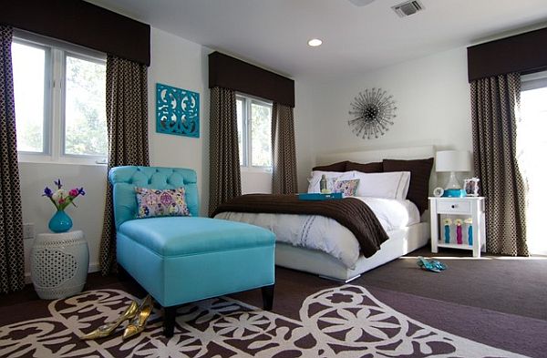 Stylish bedroom in white and chocolate brown with turquoise accent seat