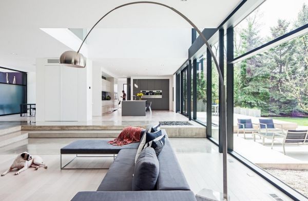 Uber modern family home with the Arco above the sectional couch