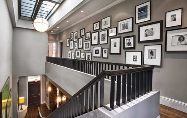 Wall next to the staircase is a popular spot for the display of photographs