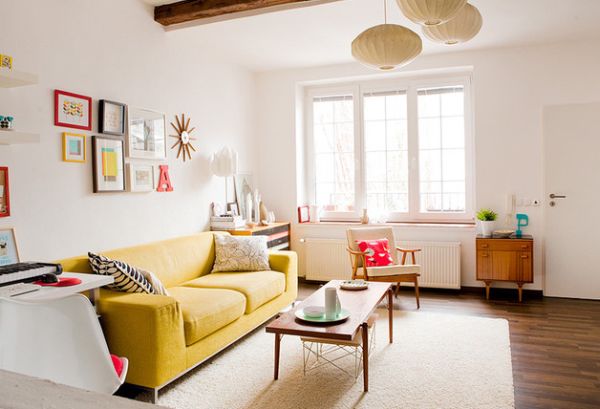 Accent couch in yellow adds warmth and freshness to a living room in white