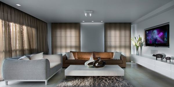 An accent couch in brown adds sophisticated contrast