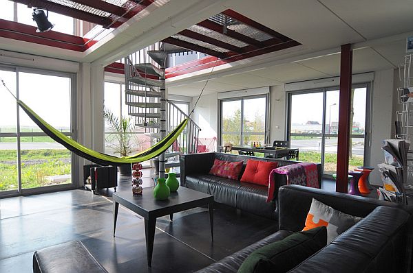 Beautiful shipping container home with a hammock in the living area