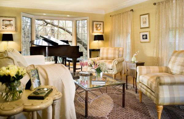 Bright and beautiful living room in golden yellows displays baby grande piano with style