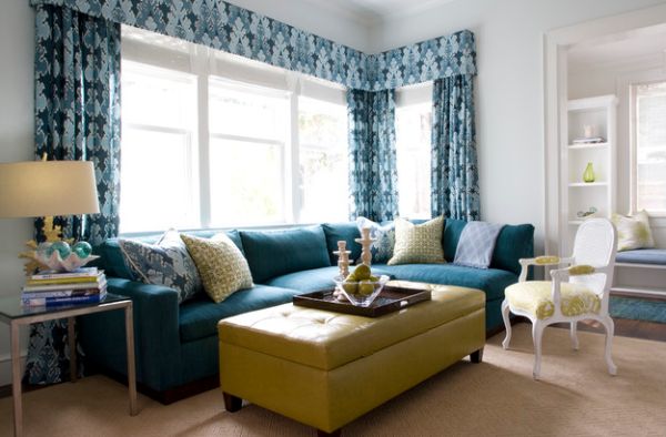 Candles and glass fruit bowl on the Ottoman offer an eclectic touch