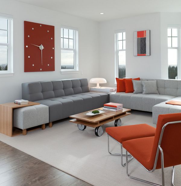 Contemporary living space with an exquisite wall clock that brings in reddish accents