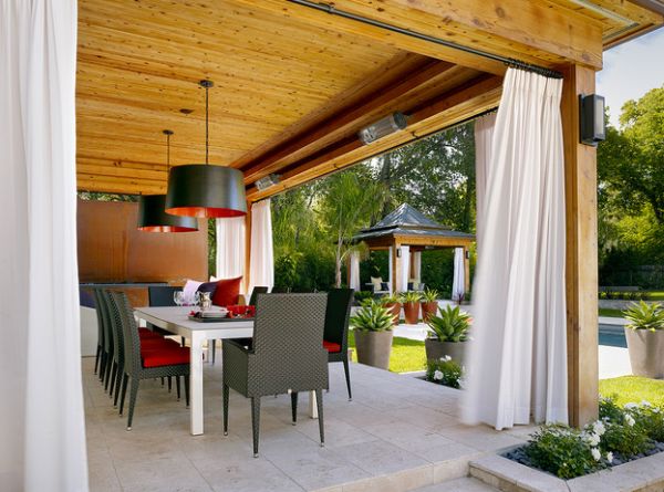 Contemporary patio showcases large drum pendants the fit into the color scheme effortlessly