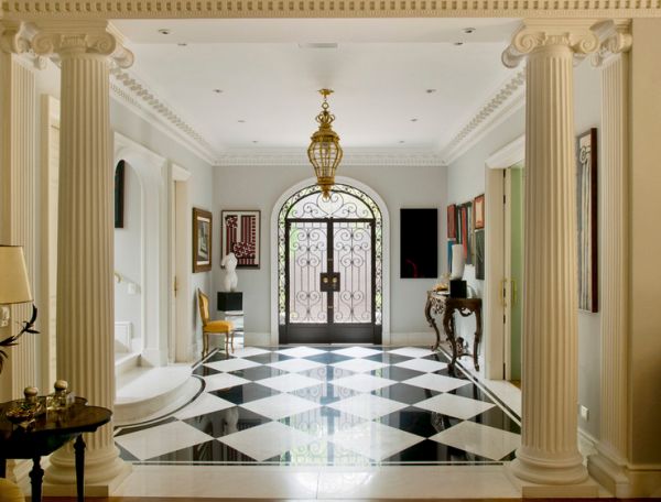 Entryway with subtle hints of gold and a lovely accent chair