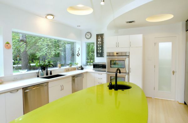 Ergonomic white kitchen with green accents and lovely lighting