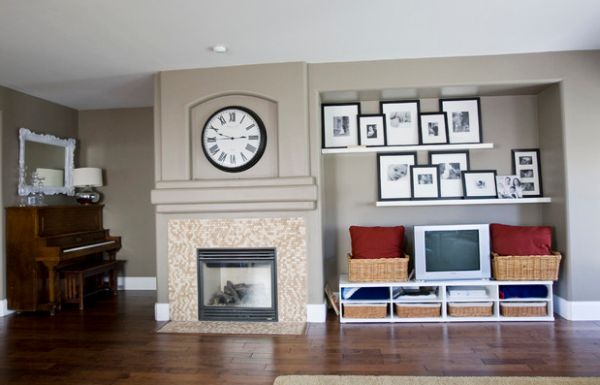 Framed family photos on the floating shelves complement the large wall clock