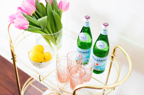 Fruit embellishes a bar cart