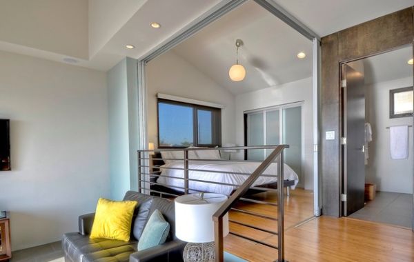 Innovative use of sliding doors to create a bedroom in an open floor plan