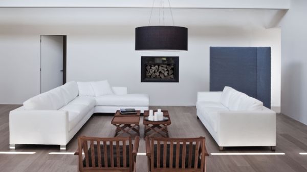 Minimal living room with a large drum pendant in black