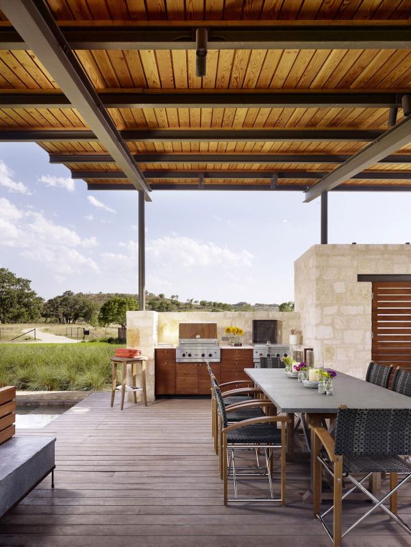 Open air kitchen and dining space of the Story Pool House