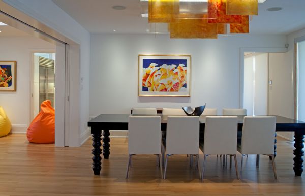 Orange and yellow panels used along with recessed lighting to create unique interiors