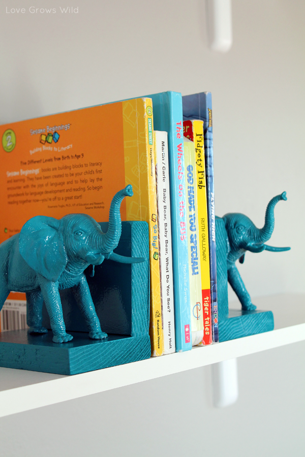 Painted plastic elephants bookend