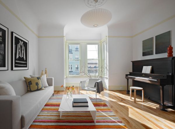 Piano in dark wood offers perfect contrast in a light and airy modern family room