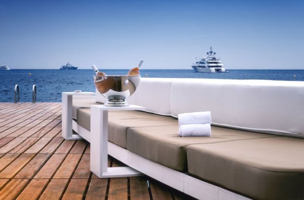 Plush daybeds at the floating beach bar in Monaco