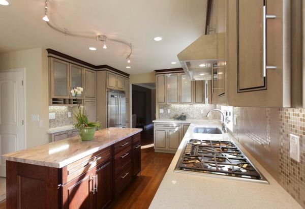 Rail lighting combined with recessed lights in this modern kitchen