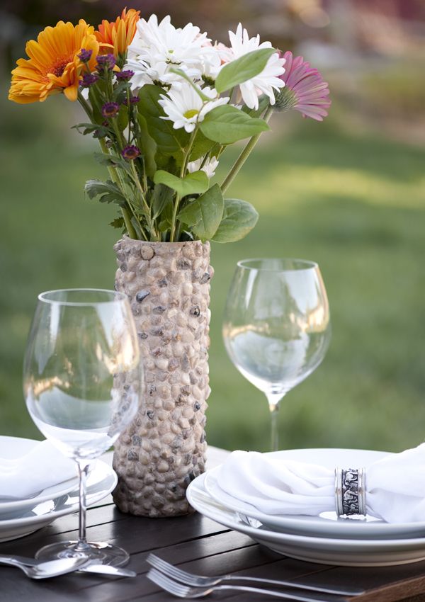 Rock covered vase made from pringles can