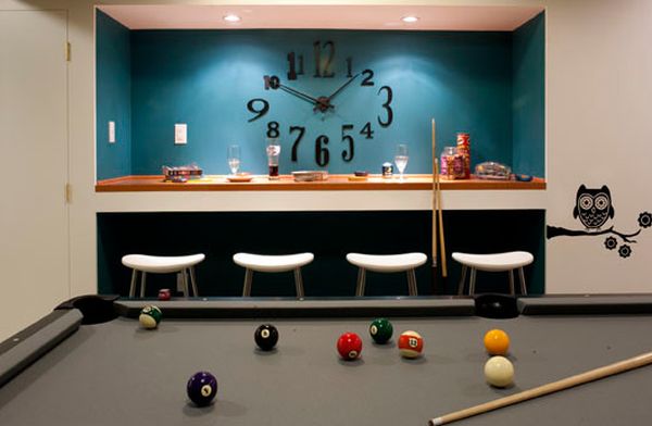 Smart recessed lighting highlights the large clock and colorful backdrop perfectly