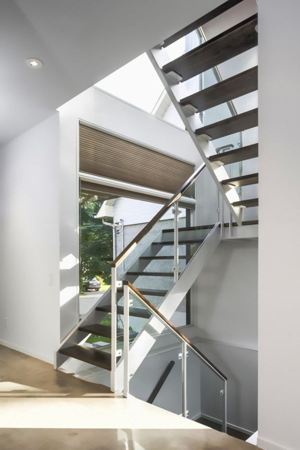 Steel staircase with glass railing in Zen Barn