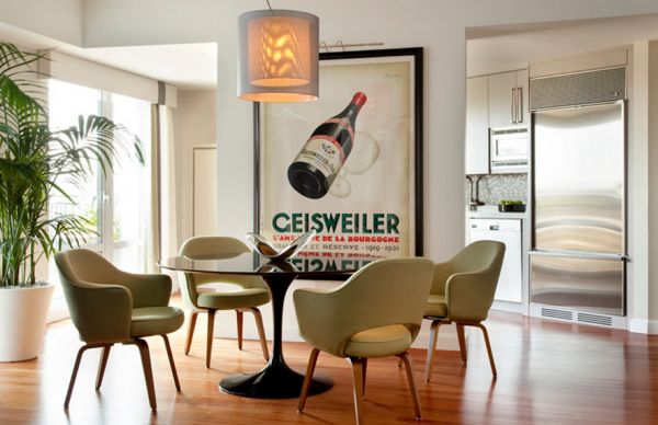 Stylish dining room with an intoxicating poster and Saarinen's design icons