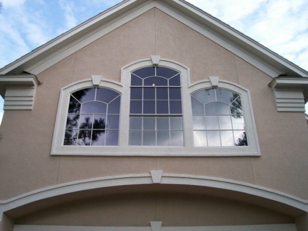 This home’s multi-shape panes are covered with silver deposition film