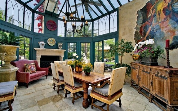 Dining room with peaked glass roof enjoys the view and protection