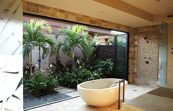 Tropical foliage bring the outdoors into this modern bathroom