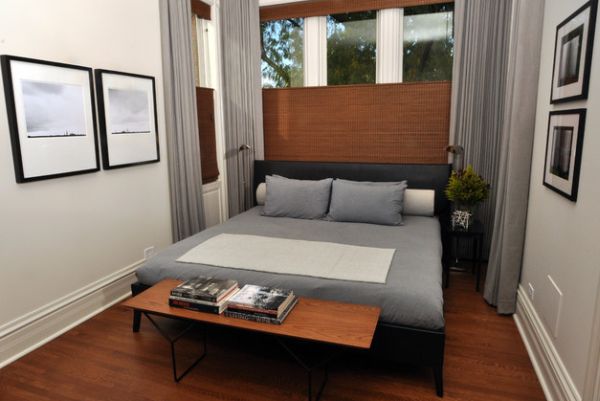 Warm wooden tones combined with soothing gray in a compact bedroom