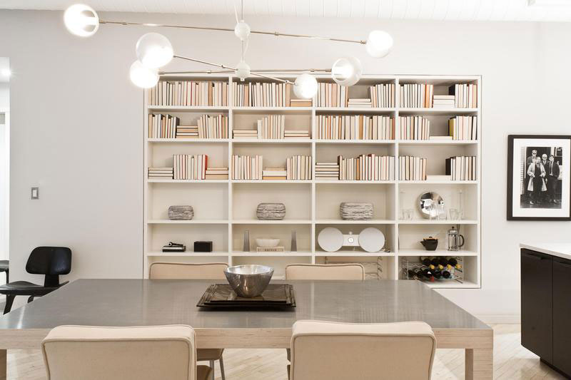 modern dining room with bookcase