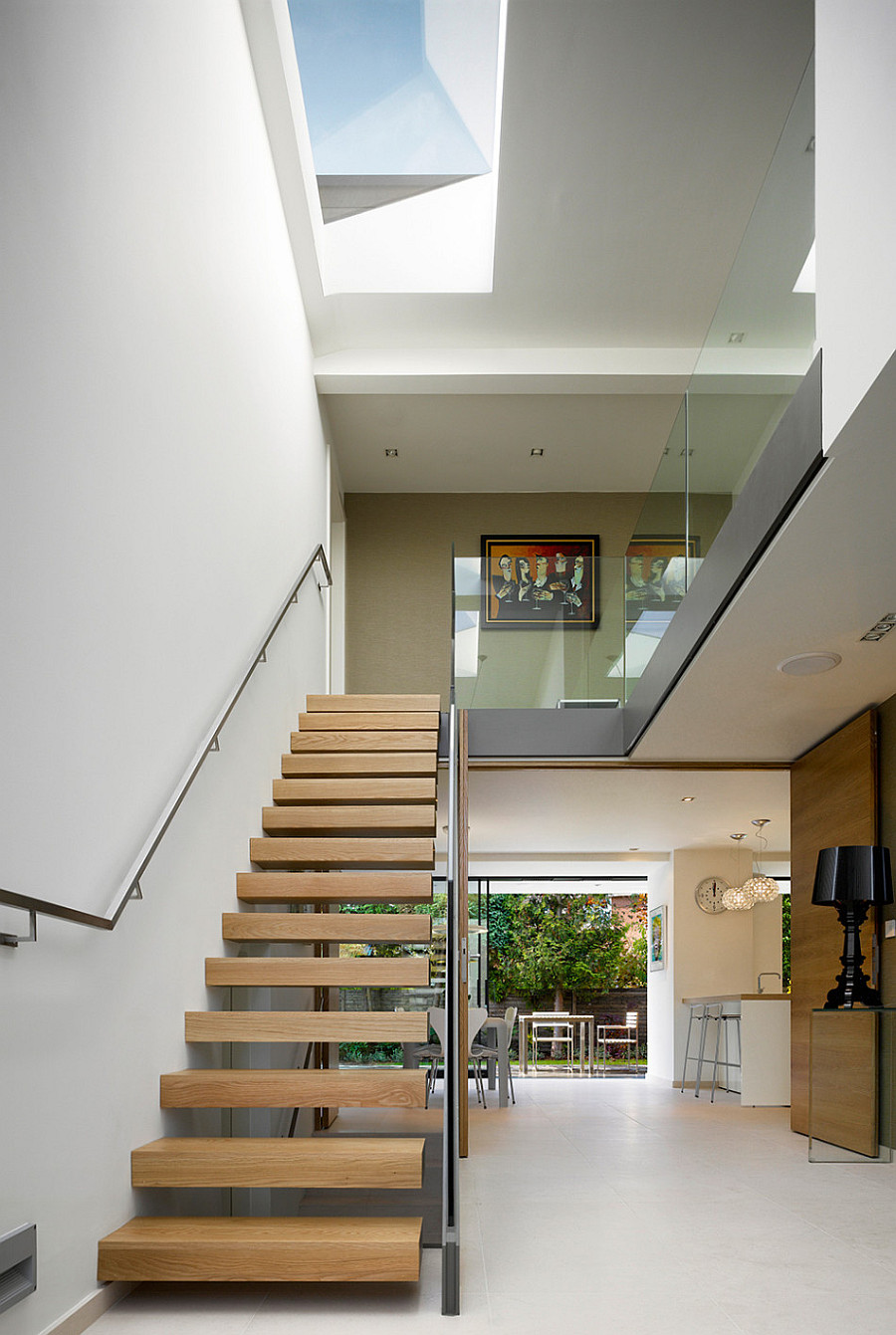 open space kitchen and wooden stairs